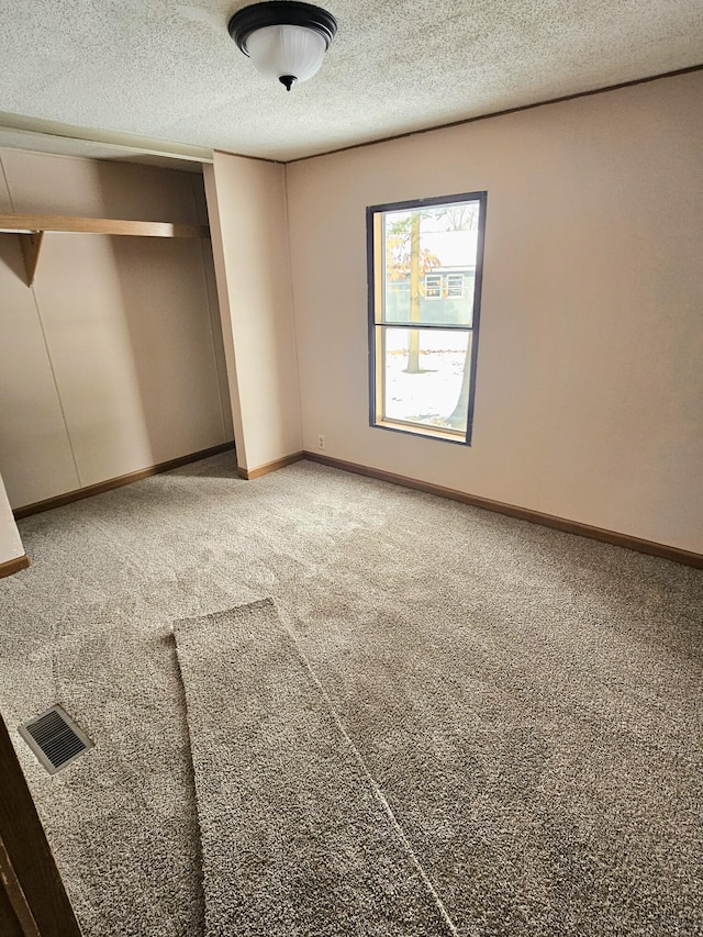 unfurnished bedroom featuring a closet and carpet