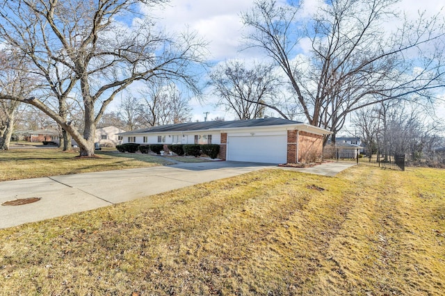 ranch-style house with fence, driveway, an attached garage, a front lawn, and brick siding