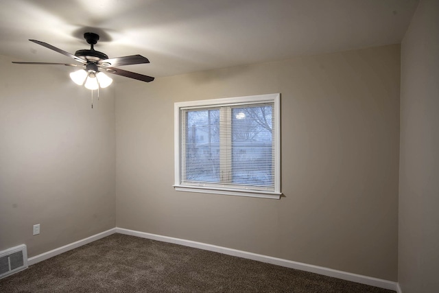 carpeted empty room featuring ceiling fan