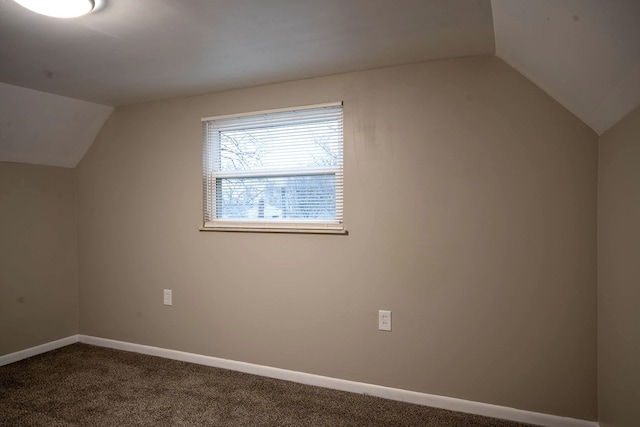 bonus room featuring lofted ceiling and carpet flooring