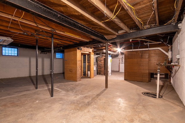 basement featuring washer / dryer and water heater