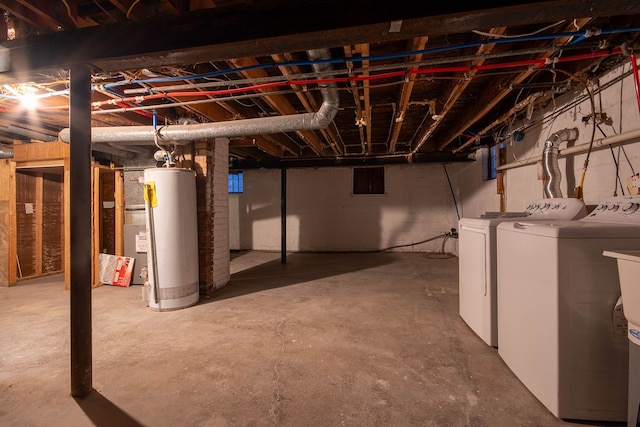 basement featuring washer and dryer and gas water heater