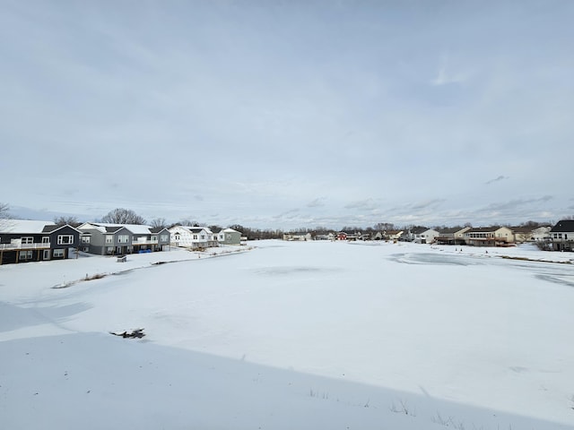 view of yard layered in snow