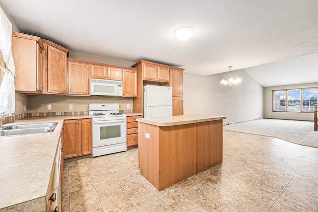 kitchen with a kitchen island, sink, a chandelier, hanging light fixtures, and white appliances