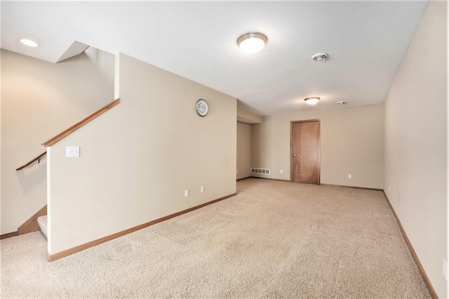 spare room with light colored carpet