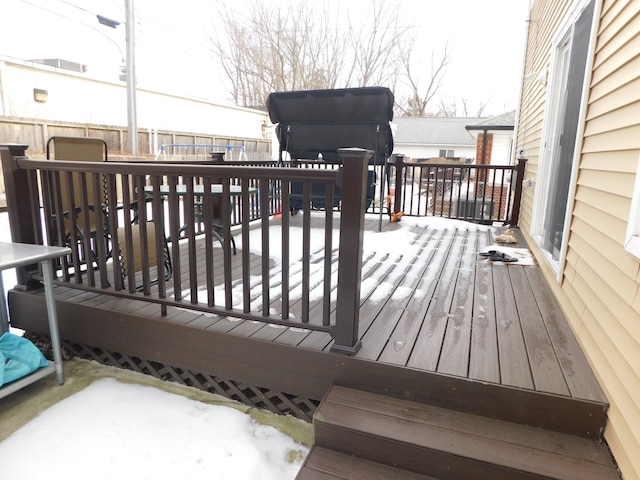 view of snow covered deck