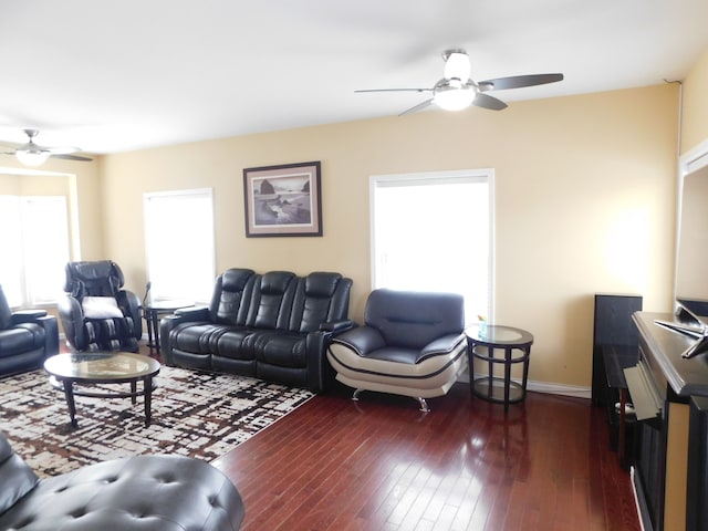 living room featuring dark hardwood / wood-style floors and ceiling fan