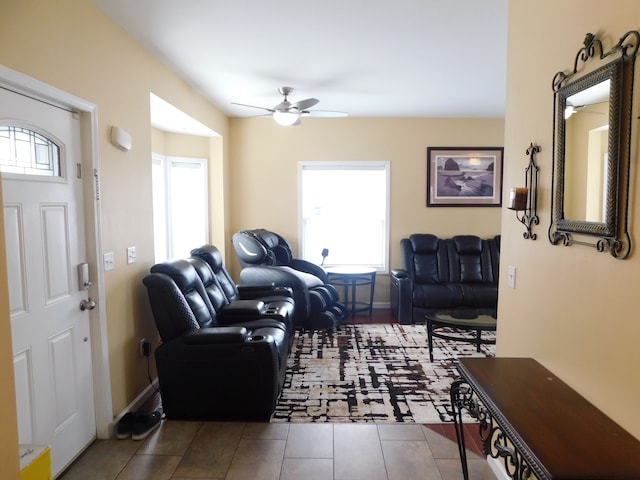 tiled living room with ceiling fan