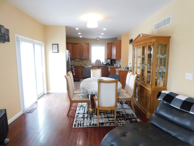 dining area with dark hardwood / wood-style floors