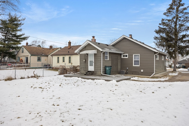 view of snow covered house