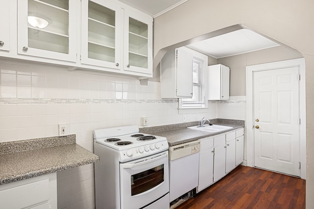 kitchen with sink, white appliances, and white cabinets