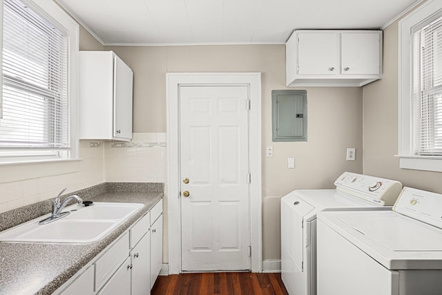 laundry area with dark wood-type flooring, sink, plenty of natural light, electric panel, and washing machine and dryer