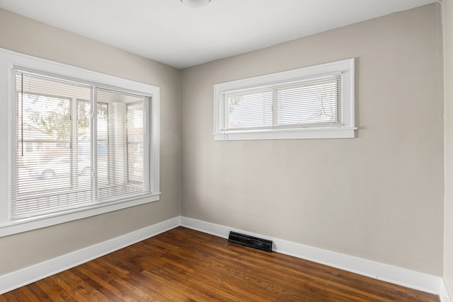 empty room featuring dark hardwood / wood-style floors