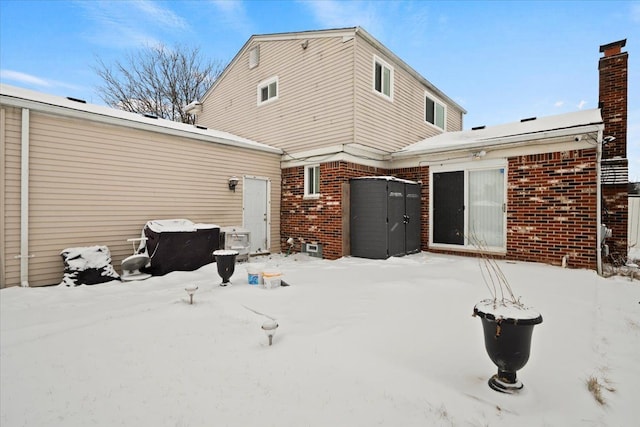 view of snow covered house