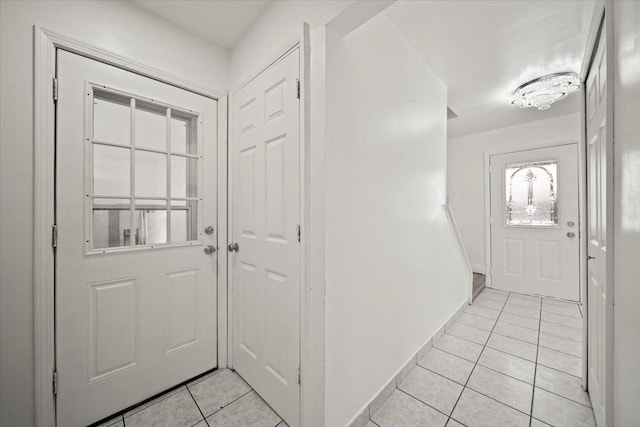 entryway with light tile patterned floors