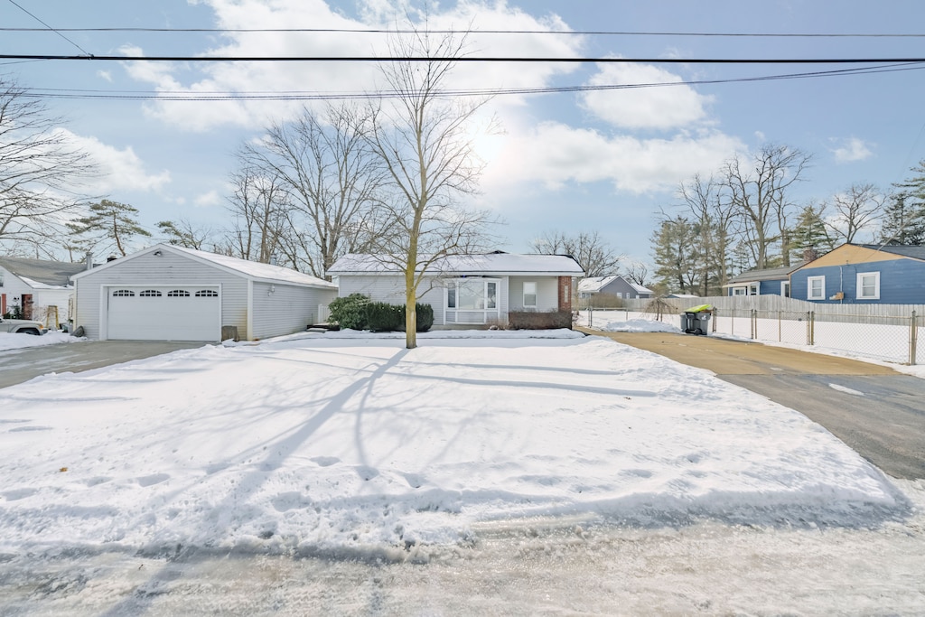 ranch-style house with an outbuilding and a garage