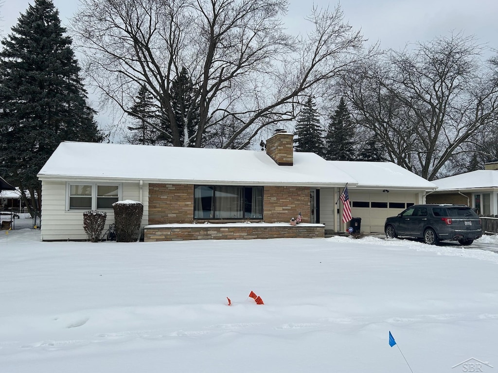 single story home featuring a garage