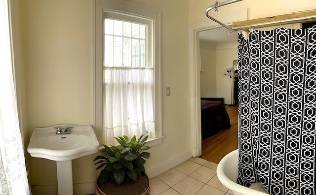 bathroom featuring shower with separate bathtub and tile patterned floors