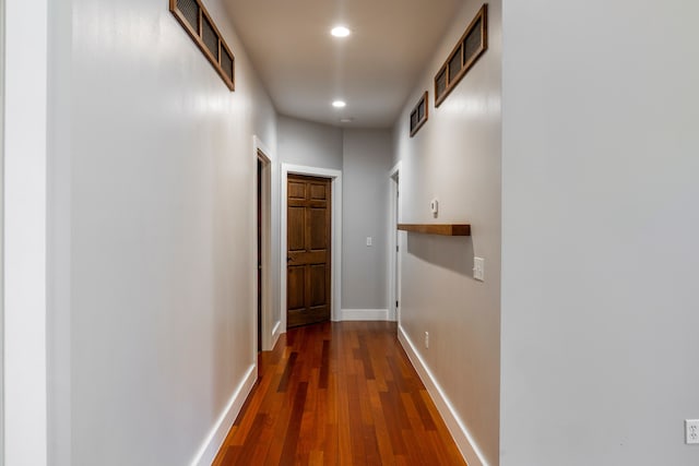 corridor featuring dark hardwood / wood-style floors