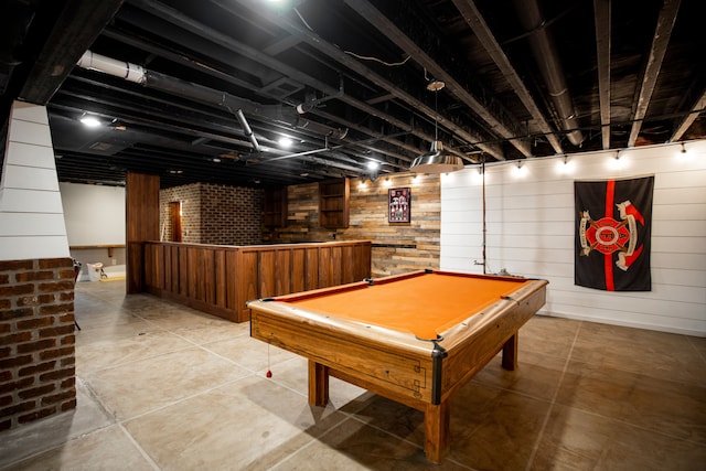 playroom featuring pool table and wooden walls