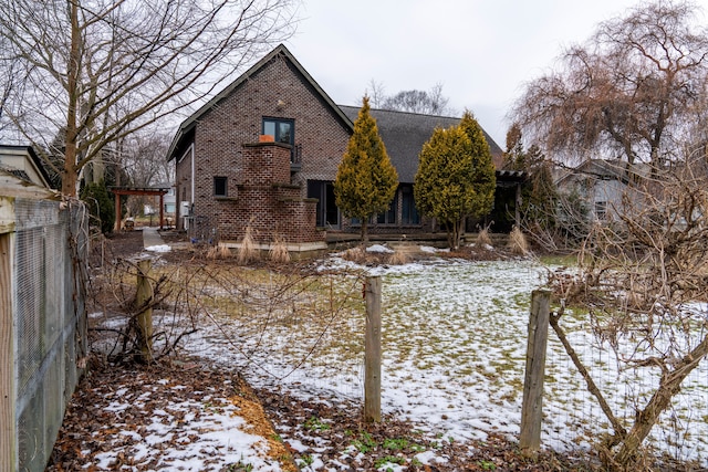 view of snow covered house