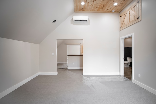 interior space featuring vaulted ceiling, wood ceiling, light carpet, and a wall unit AC