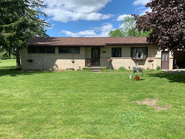 ranch-style home with a front lawn