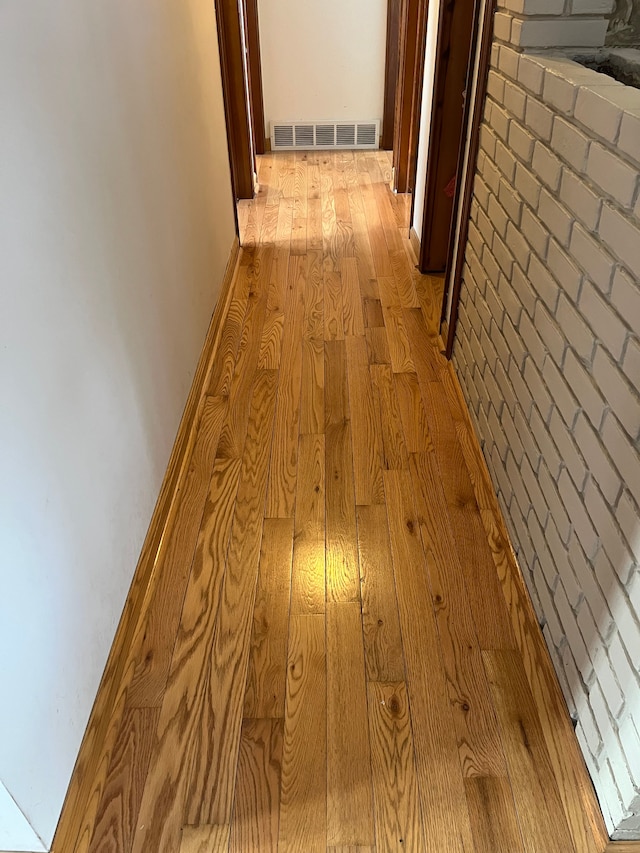 corridor featuring light hardwood / wood-style floors