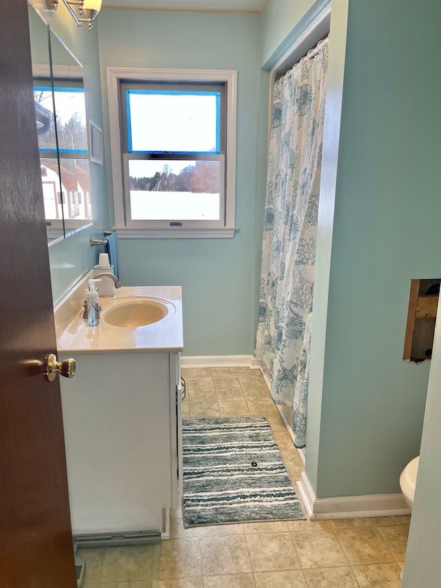 bathroom with tile patterned flooring, vanity, a shower with curtain, and toilet