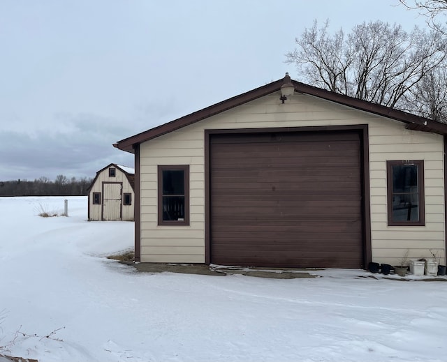 view of snow covered garage