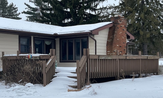 view of snow covered house