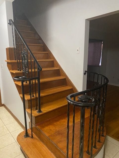 stairway featuring tile patterned floors