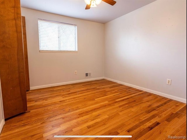 empty room with light hardwood / wood-style floors and ceiling fan