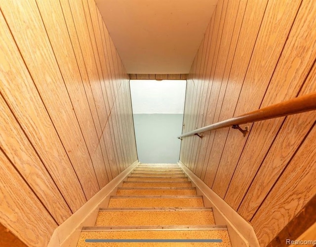 stairs with wood walls