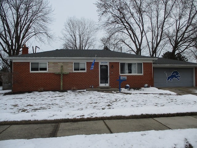 ranch-style house featuring a garage