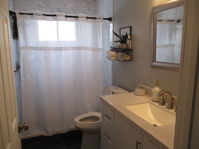 bathroom featuring vanity, a shower with curtain, tile patterned floors, and toilet