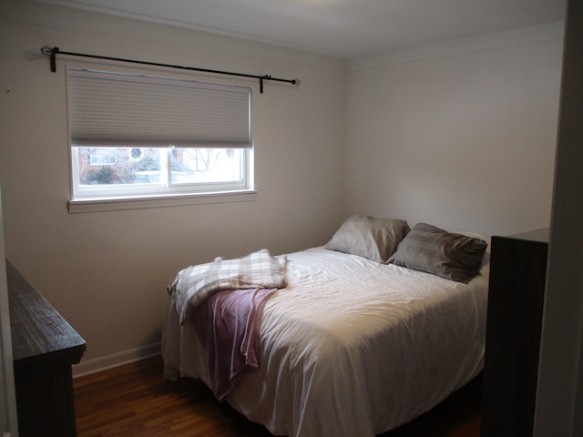 bedroom featuring dark hardwood / wood-style flooring