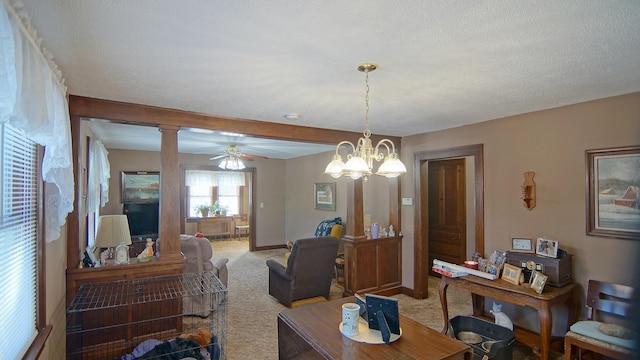 carpeted dining space with beamed ceiling, ceiling fan, decorative columns, and a textured ceiling