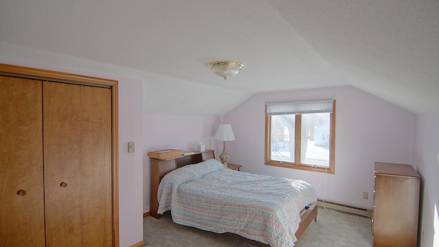 bedroom with a closet, vaulted ceiling, and light carpet