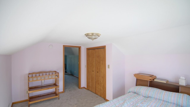 carpeted bedroom featuring vaulted ceiling