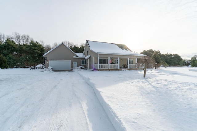 view of front of house featuring a garage and covered porch