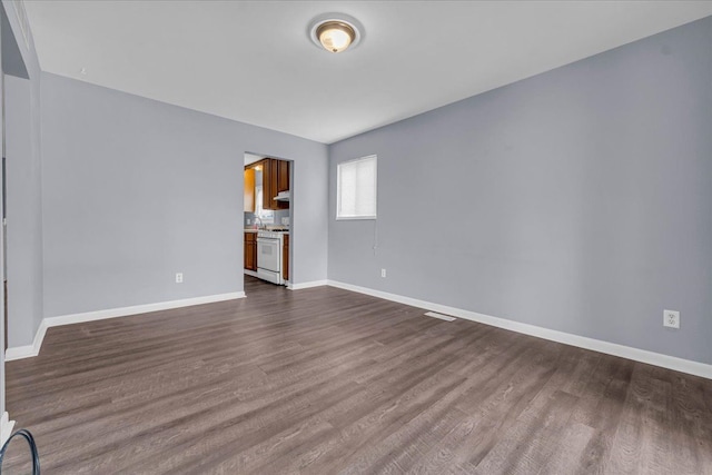 empty room featuring wood-type flooring