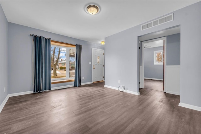 empty room featuring dark wood-type flooring