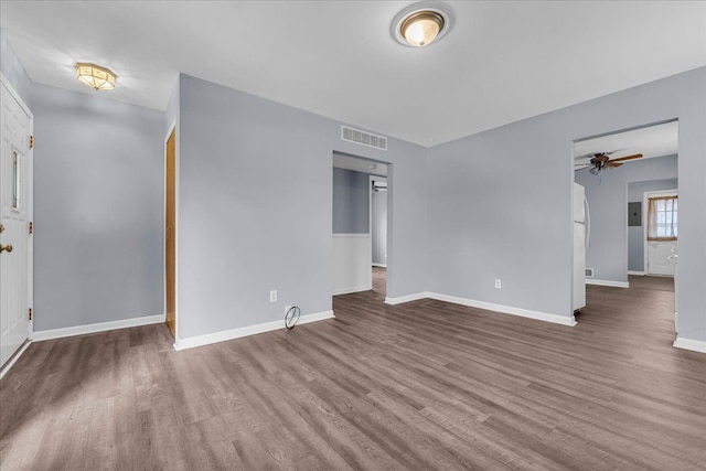 unfurnished room with hardwood / wood-style flooring and ceiling fan