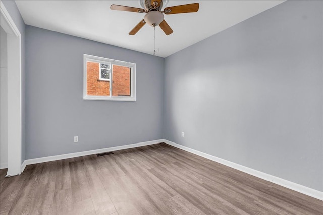 spare room with ceiling fan and light hardwood / wood-style flooring