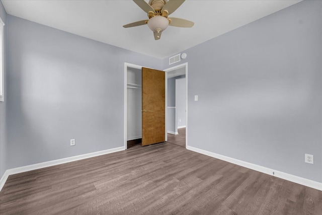 empty room featuring hardwood / wood-style floors and ceiling fan