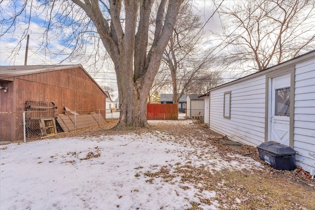 view of yard layered in snow