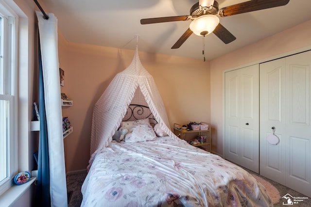 bedroom with ceiling fan and a closet