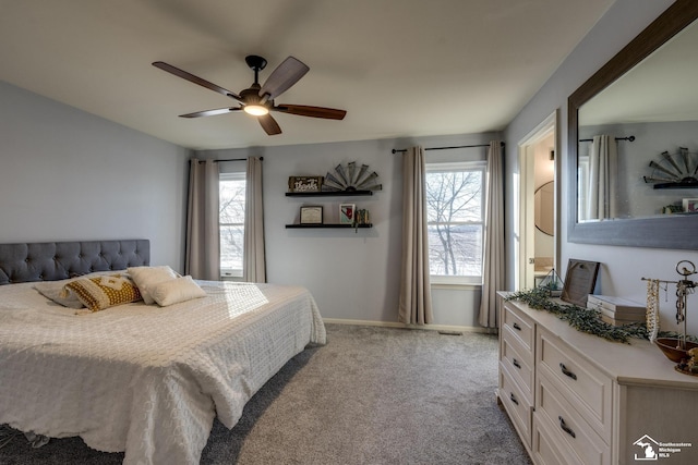 bedroom featuring light colored carpet and ceiling fan