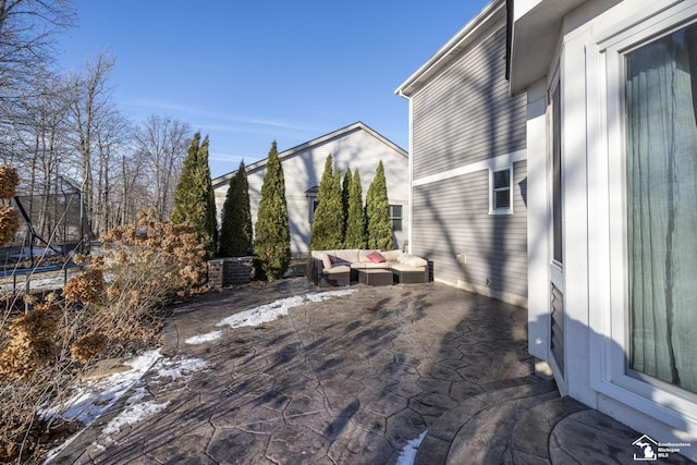 deck featuring central AC unit, an outdoor hangout area, a trampoline, and a patio area